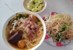 A bowl of Bún Bò Huế, a tasty local food in Hue.