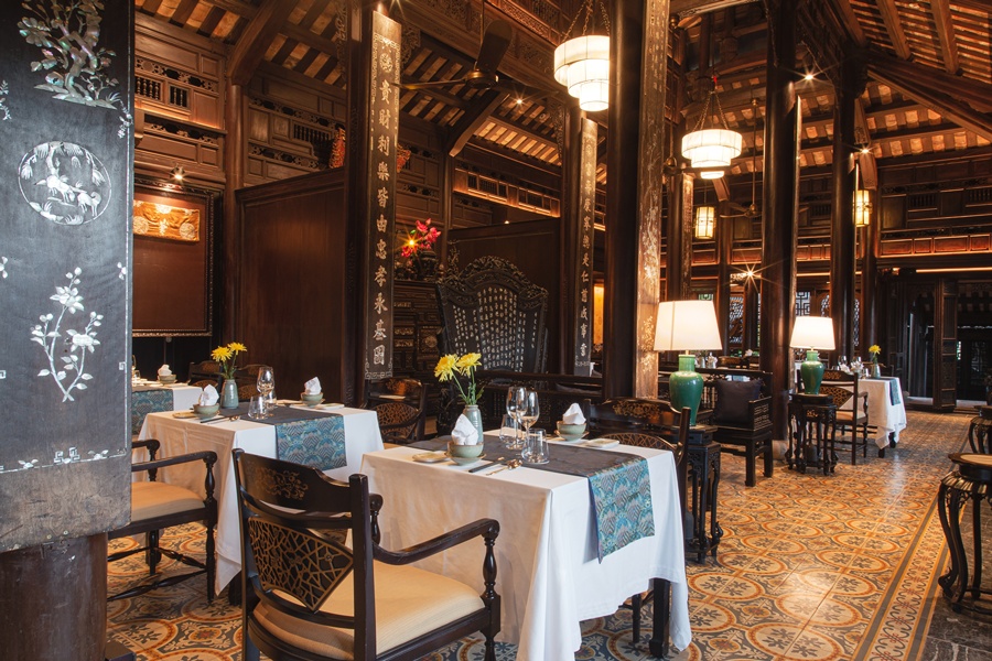 Ancient Hue Restaurant features traditional wooden architecture and serves authentic Hue cuisine