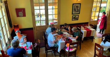 Interior Space of Le Jardin de La Carambole Restaurant in Hue with guests eating