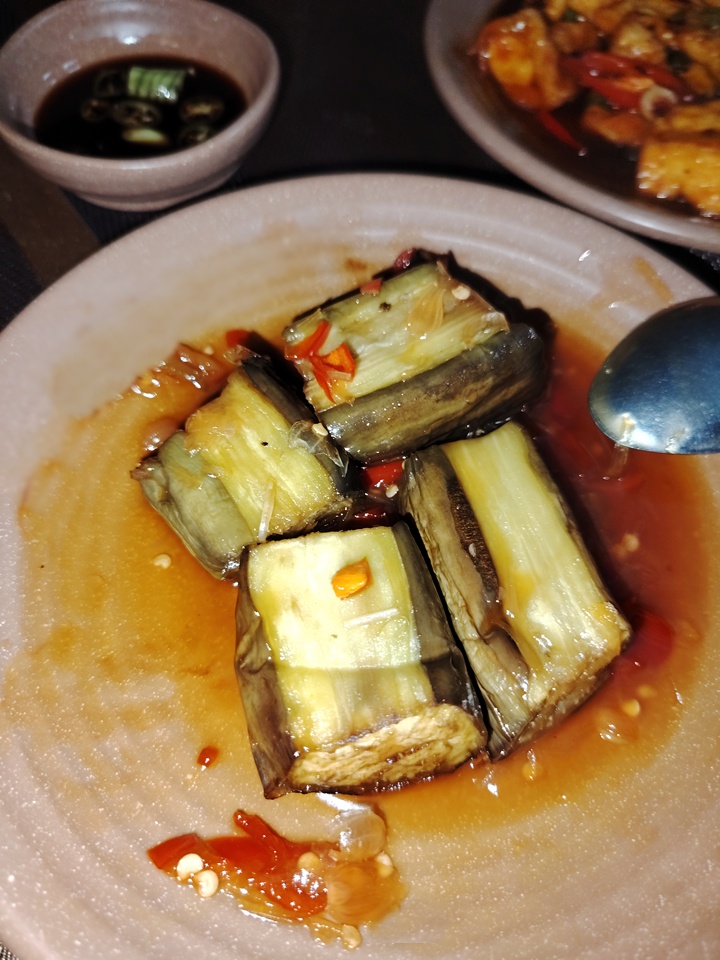 Braised eggplant with ginger in rich brown sauce, a warm and comforting vegetarian dish from Hue.