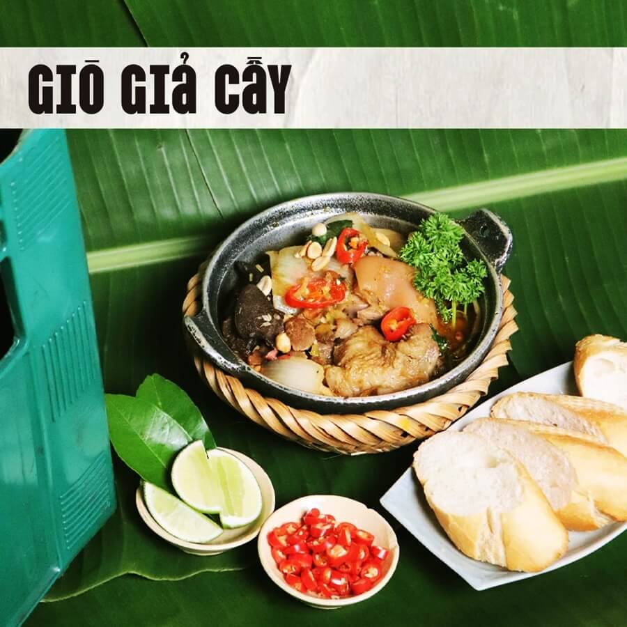 Hearty Vietnamese Pig Trotters with Fermented Rice (Giò Giả Cầy) and bamboo shoots, topped with peanuts, served at DMZ Restaurant Hue.