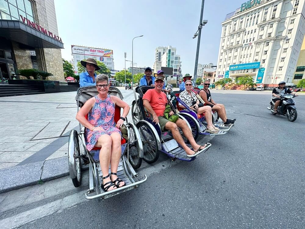 Guests on cyclo start hue street food tour